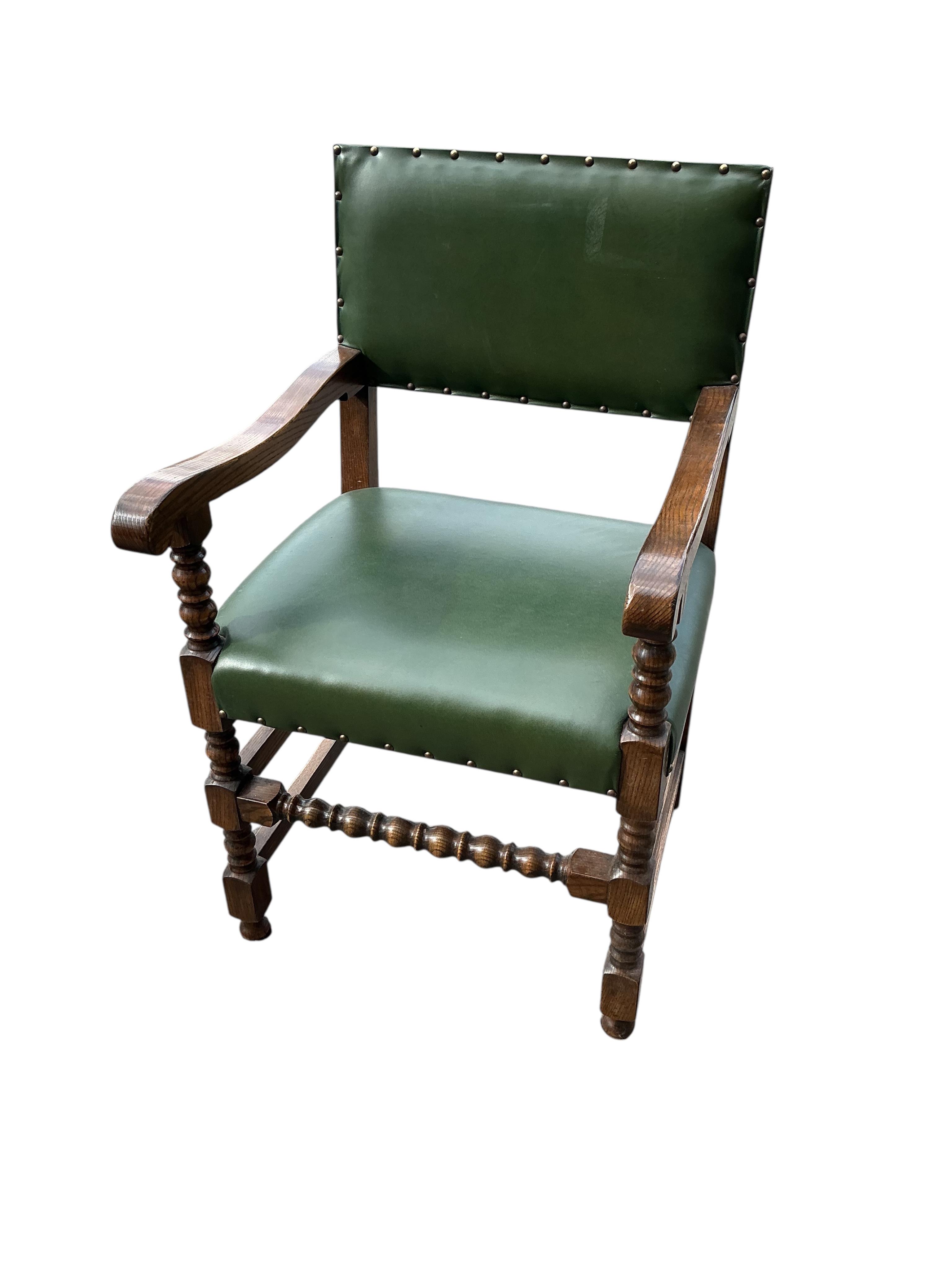 A set of twelve Bevan Funnel oak dining chairs, two with arms